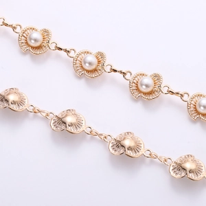 Elegant gold plum blossom belt chain for dresses featuring ocean shell motifs and pearls