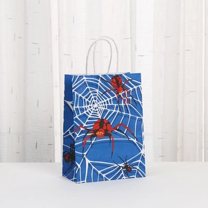 Blue paper gift bag with spider web print and red spider patterns for party favors