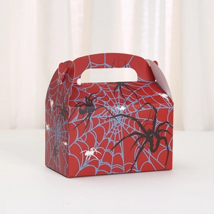 Detail of red Halloween paper gift box with blue spider web and black spider motifs