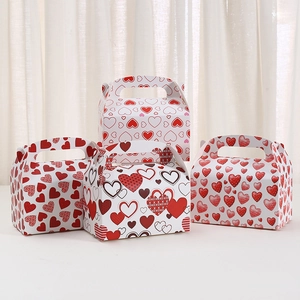 Kraft paper gift boxes with heart prints and integrated handles for Valentine's day