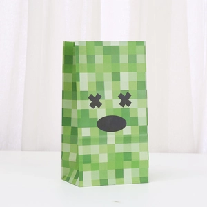 Green pixel style kraft paper gift bag featuring a black character face design for parties