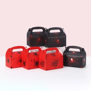 Macro view of Spider-man themed gift boxes with red and black web patterns and handle