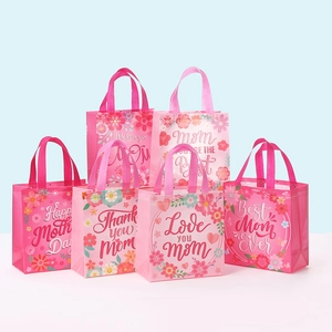 Detailed view of assorted pink floral non-woven gift bags for Mother's Day