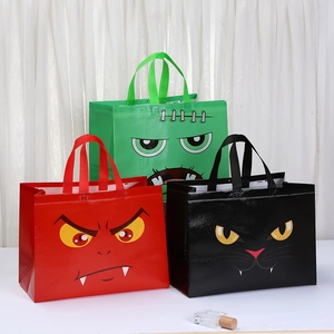 Three Halloween monster gift bags in red, green, and black with durable non-woven texture