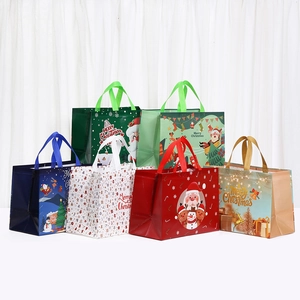 Set of 6 festive non-woven Christmas gift bags with Santa, reindeer and snowman designs