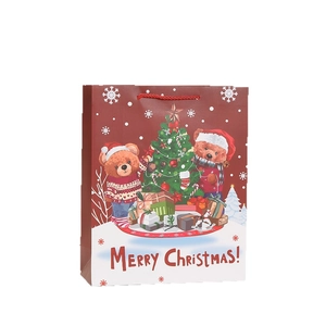 Sac cadeau de Noël en papier avec oursons et texte festif et poignées rouges tressées