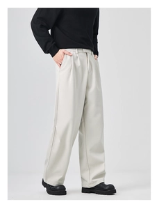 Detailed side view of loose straight casual trousers in grey with soft wrinkle-resistant fabric