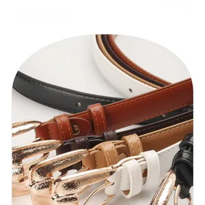 Detail of colorful slim PU leather belts with elegant golden metal buckles and stitching