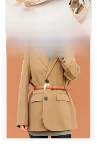 Detailed view of women's brown PU leather belt with a golden oval buckle and fine stitching