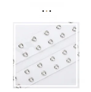 Close-up of transparent PVC belt with double-row silver metal eyelets and fine craftsmanship