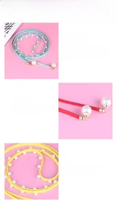 Detail of skinny bow pearl waist belts in blue, red, and yellow with gold floral buckle