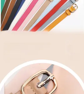 Close-up detail of multi-color slim leather belts with oval metal buckles for women