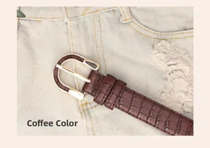 Detailed macro view of coffee brown crocodile pattern leather belt with golden D-ring buckle
