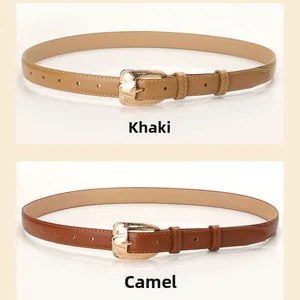 Detail view of thin PU leather belts in khaki and camel with golden alloy buckles