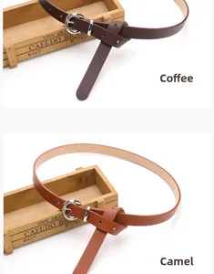 Detail view of coffee and camel skinny faux leather belts with silver round pin buckles
