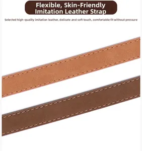 Detail of supple faux leather belts in brown and tan with fine tonal stitching