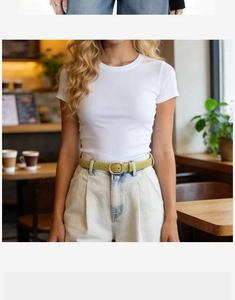Close-up of minimalist avocado green leather belt for women with elegant golden metal buckle