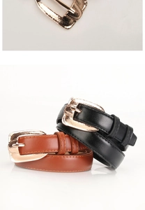 Close-up of hammered rose gold metal buckle and two-pack textured PU leather belts
