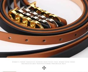 Detail of leather waist belts with figure-8 metal buckles in gold and silver finish