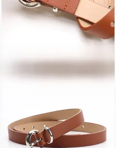 Detailed view of brown leather belt featuring a round silver buckle and smooth texture