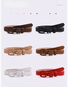 Detail view of colorful PU leather belts for women with matching five-petal flower buckle