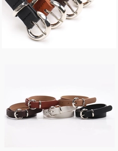 Close-up of alloy pin buckle and multi-color slim belts in black brown white