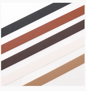 Detailed view of women leather belts in black, caramel, coffee, and beige lychee texture