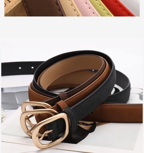 Detail view of thin nubuck leather belts with vintage gold buckles in various colors