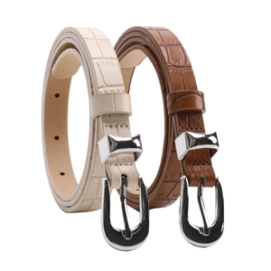 Chic women belts in cream and brown with crocodile pattern and silver bow buckles