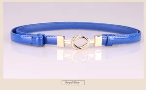 Detail shot of royal blue patent leather skinny belt with double gold ring buckle and stitching