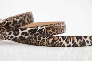 Detail of leopard print PU leather belt with stitching and adjustment holes