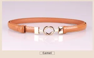 Close-up of camel slim belt featuring a gold interlocking twist metal buckle and shiny finish