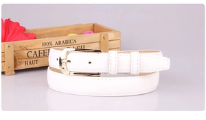 Detailed view of a white PU leather belt for women featuring a golden alloy buckle