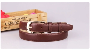 Detail of a dark brown PU leather thin belt for women featuring a gold pin buckle and stitching
