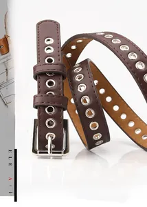 Close-up of dark brown leather belt with silver eyelet studs and metal pin buckle