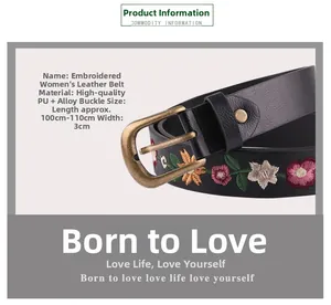 Close-up of vintage embroidered floral belt with bronze alloy buckle and PU leather texture