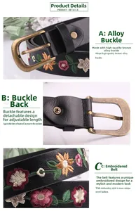 Close-up of vintage black leather belt with floral embroidery and antique bronze buckle