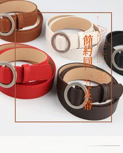 Detail view of colorful PU leather belts with round metal buckles and stitch finish