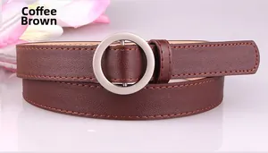 Close-up of dark coffee leather belt with a round silver buckle and fine stitching
