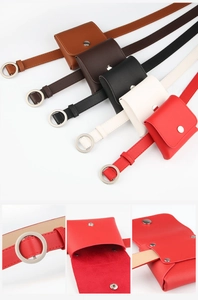 Detail view of the silver metal ring buckle and minimalist leather waist bag structure
