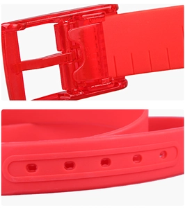 Detail of red silicone belt with translucent finish and plastic pin buckle close-up