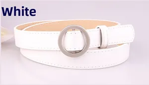 Close-up of a white minimalist waist belt with a matte silver circular metal buckle