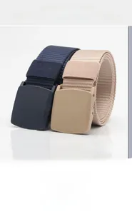 Detail view of navy blue and khaki canvas belts with matte plastic automatic buckles