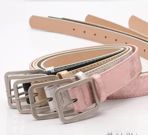 Detail of multi-color women belts with polished alloy buckles and textured faux leather finishes