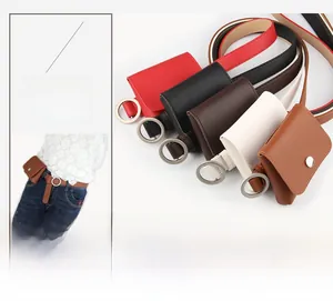 Detail of multi-color slim leather belts with round metal buckles and matching waist bags