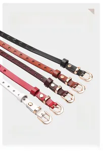 Detail of genuine leather belts for women with star cutouts and golden D-shaped buckles