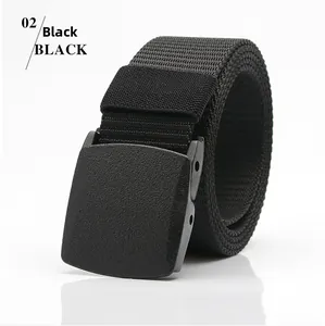 Detail of black tactical canvas belt with matte plastic buckle on white background