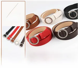 Detail of minimalist women's PU leather thin belts with round metal buckle in five colors