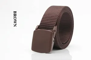 Detail of a brown nylon woven belt with a matte plastic buckle for outdoor activities