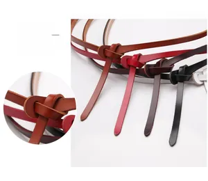 Detailed view of multiple slim leather belt colors and the stylish knot tying design